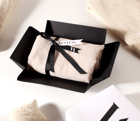Cardboard shirt box with stopper