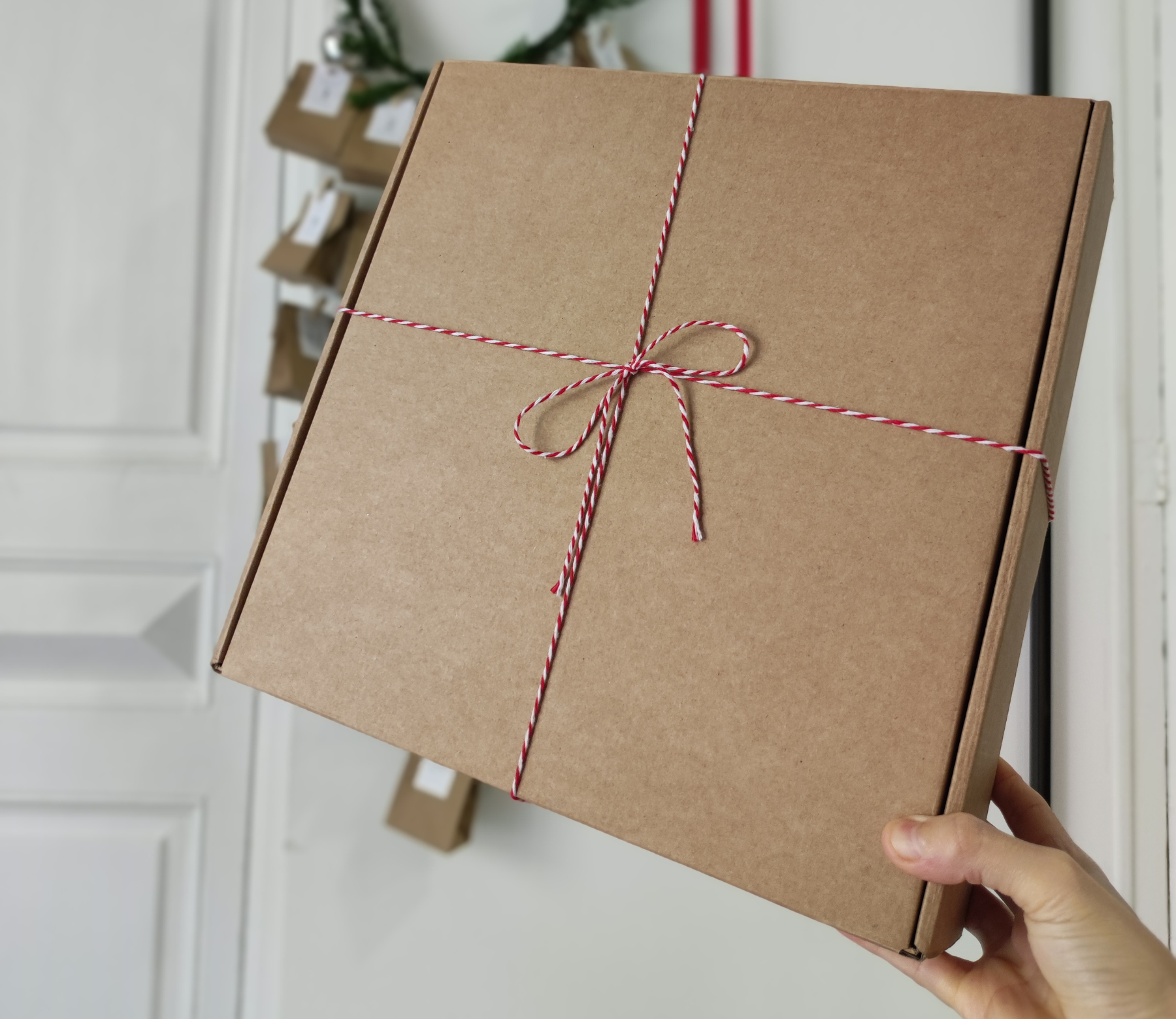 Cardboard shipping box with Christmas decorations 