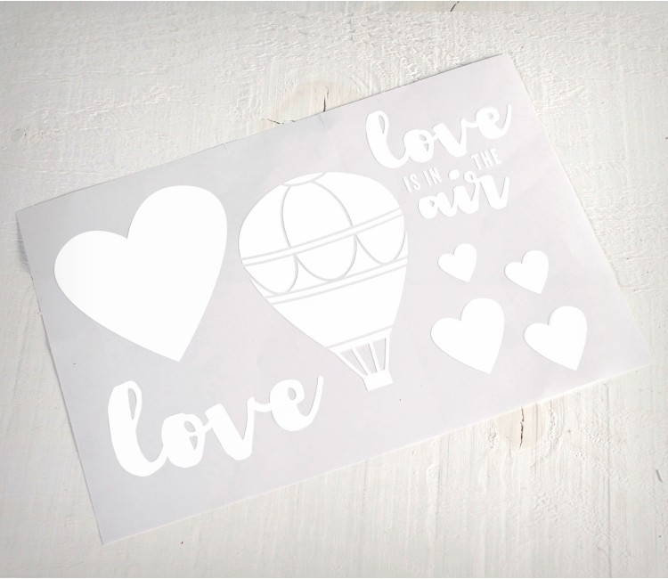 Dekorativer Vinylaufkleber mit dem Aufdruck „Love is in the Air“