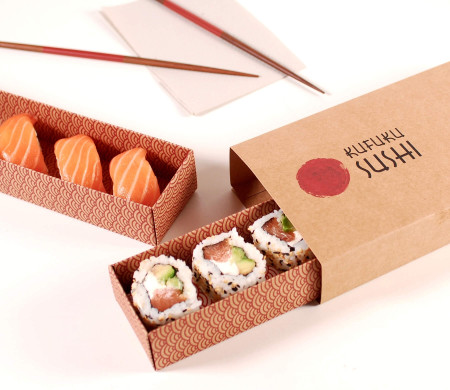 Long cardboard box for sushi with a sleeve.